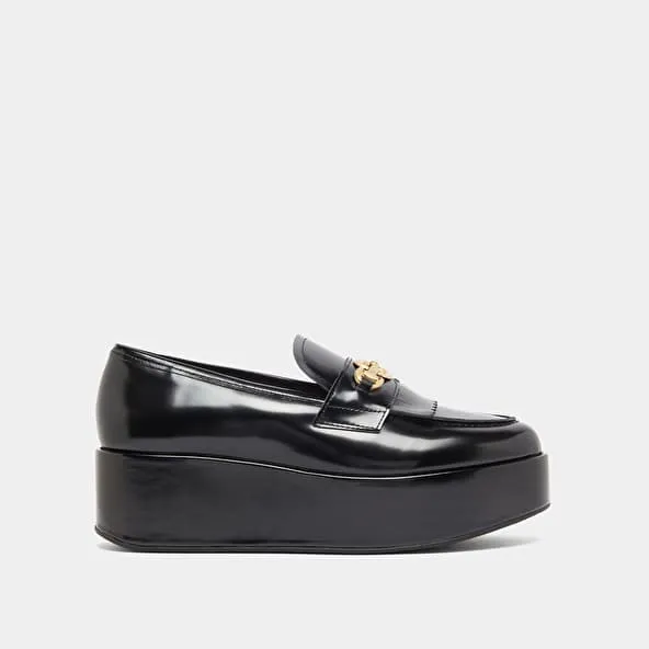 Gold buckle loafers in black glazed leather